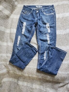 Women’s Blue Distressed Boot-Cut Jeans
